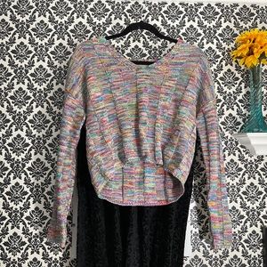 A stylish knitted cropped sweater.